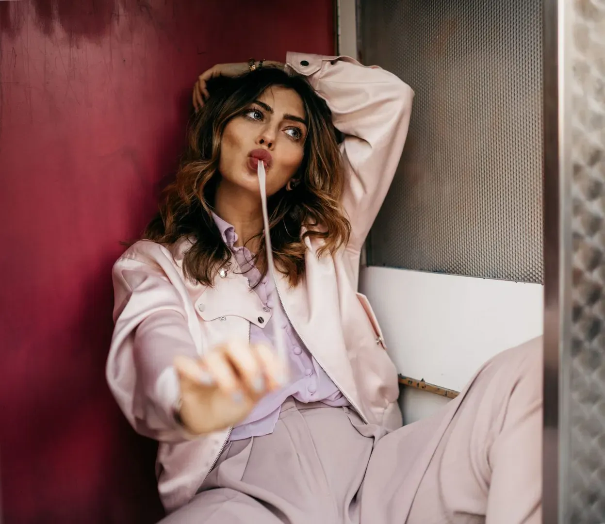 A high-energy model exuding confidence after a revitalizing chew of HelloWhatever Gums.