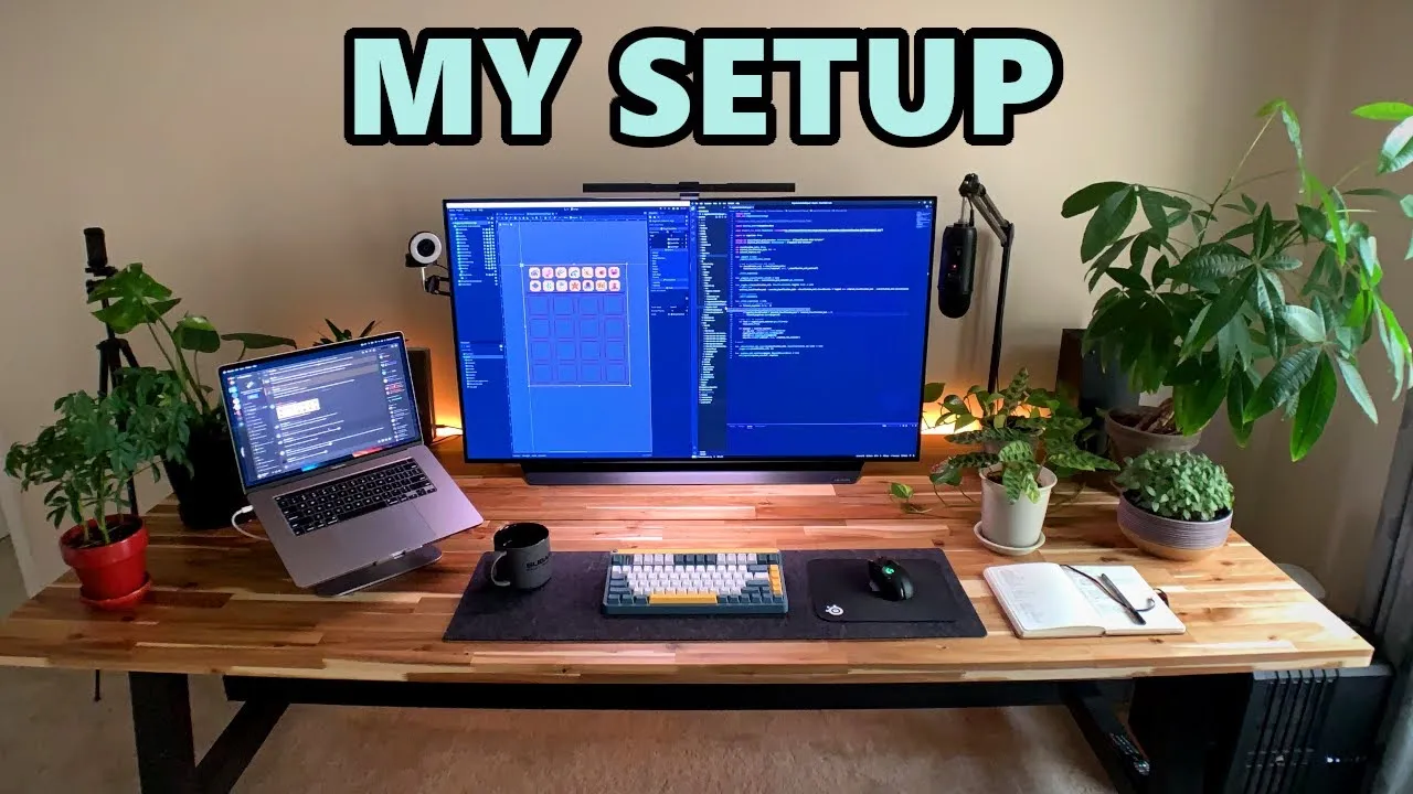 A personal workspace with dual monitors, gaming accessories, and vibrant decorations, highlighting a comfortable game development station.