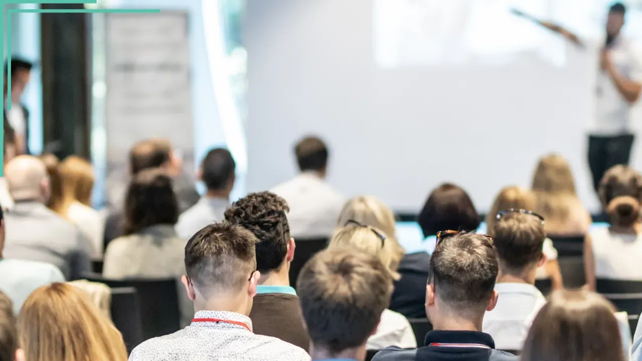 Collaborative workspace with individuals discussing and strategizing on game mechanics.